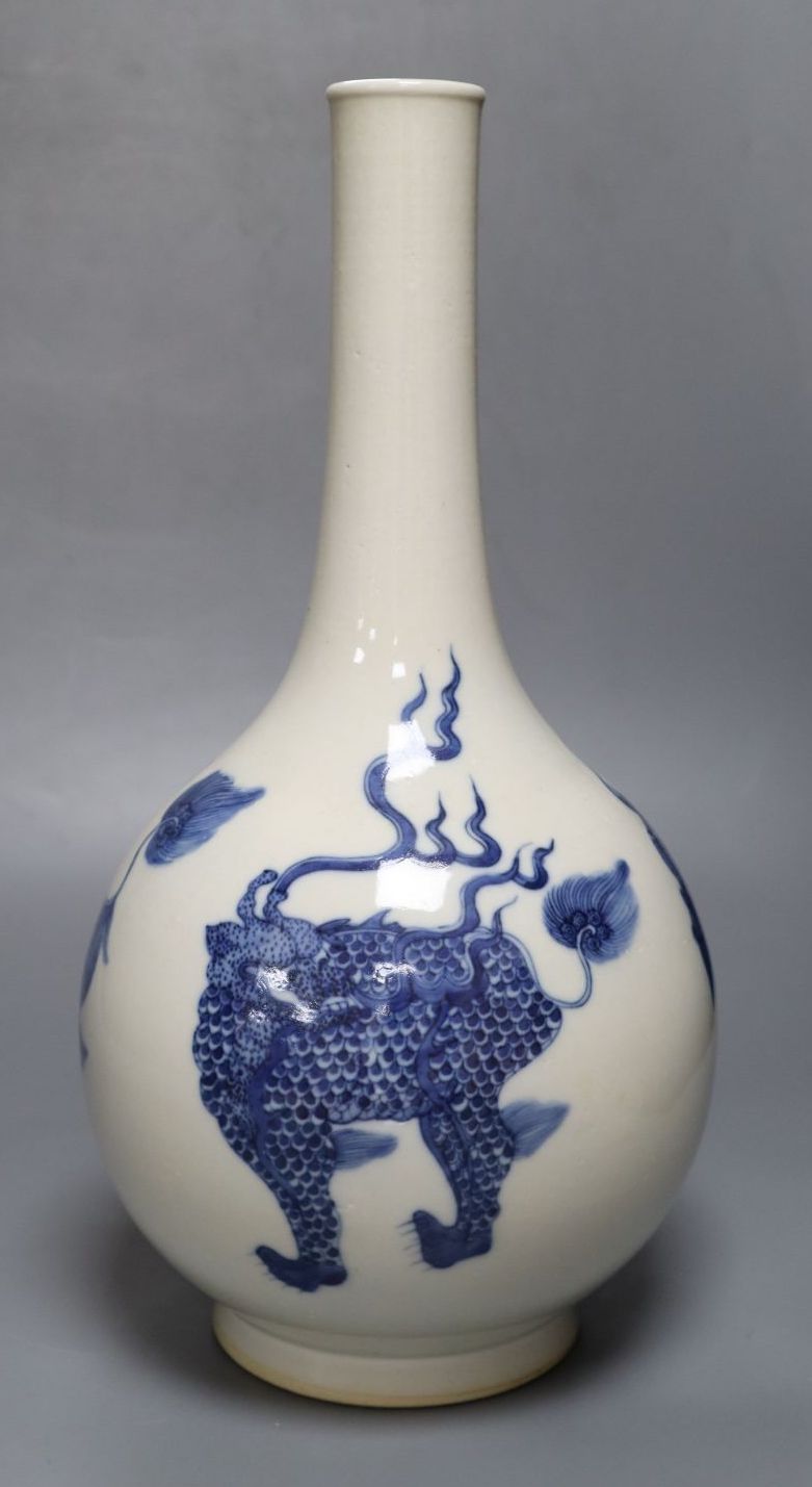 A Chinese porcelain blue and white bottle vase, painted with dragons in underglaze blue